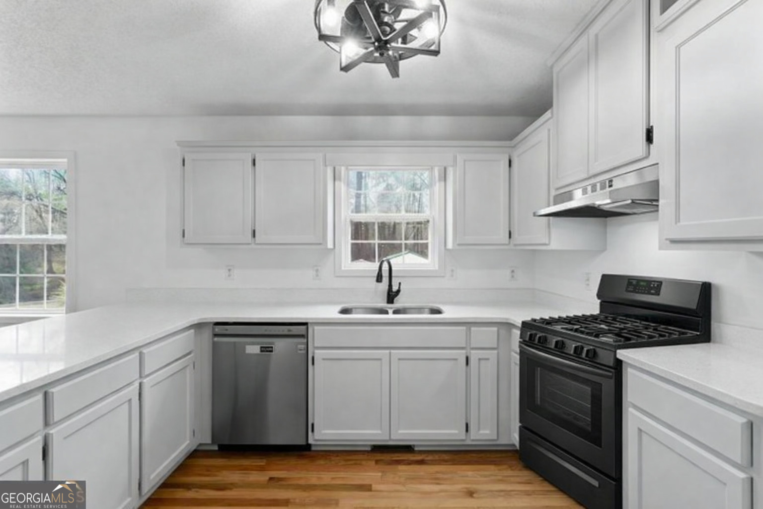 2093 Highway 36 Milner, GA 30257 - Photo 7 of 18 a kitchen with cabinets appliances a sink and a window
