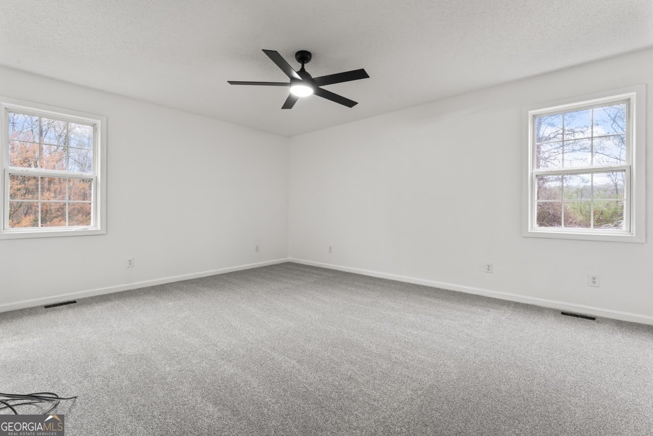 2093 Highway 36 Milner, GA 30257 - Photo 10 of 18 a view of an empty room with a window