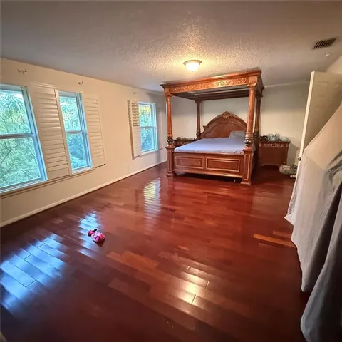 a bedroom with furniture and window