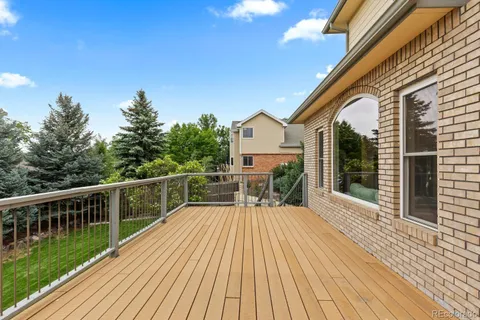 a view of house with a deck