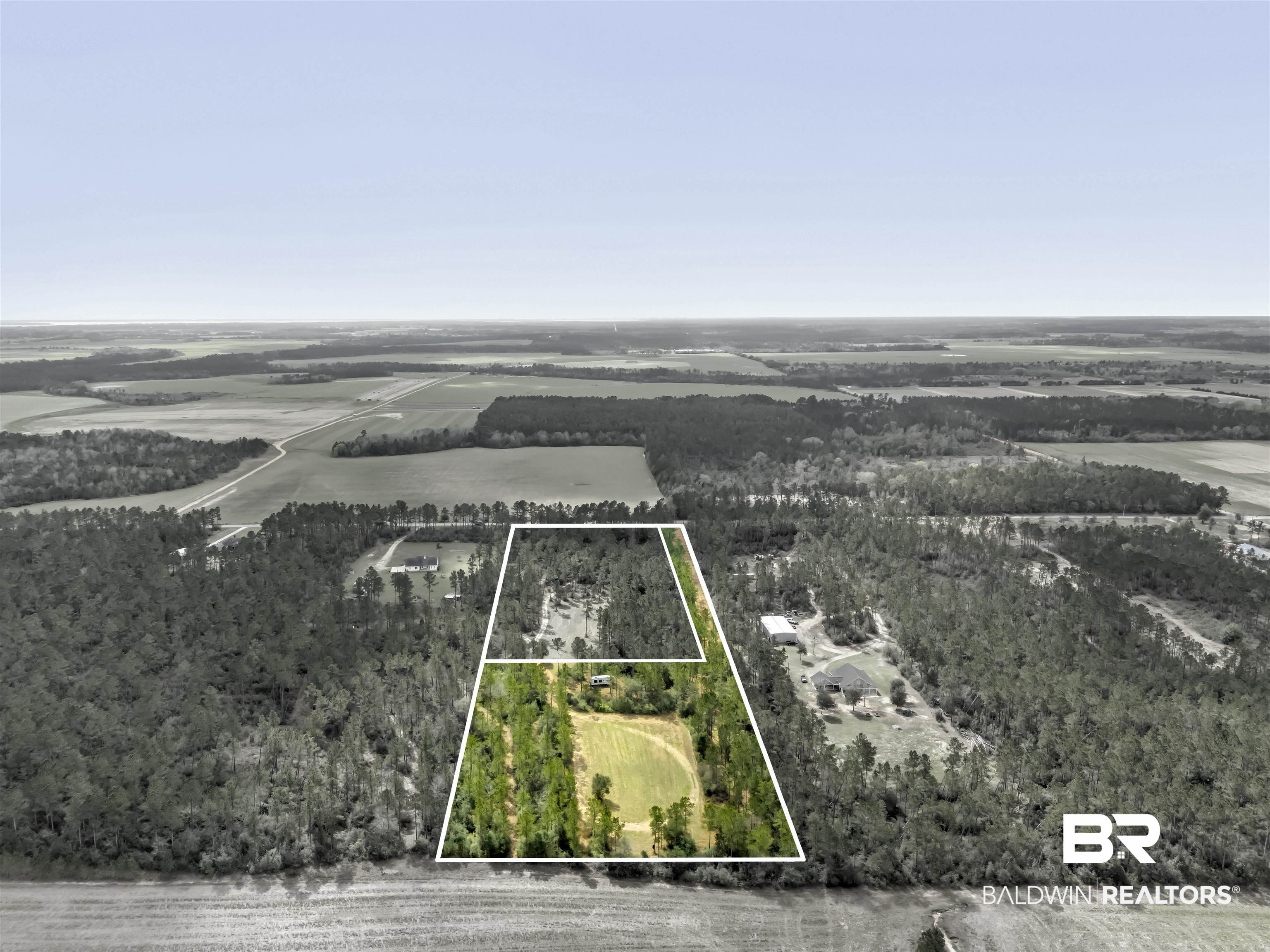 30247 Gardner Road Elberta, AL 36530 - Photo 3 of 19 Aerial view of sparsely populated area featuring property parcel outlined and a forest