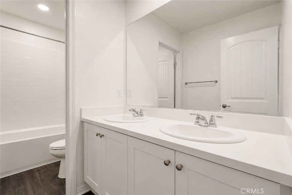 11056 Guffey Ranch Way Corona, CA 92883 - Photo 34 of 61 a bathroom with a sink a toilet and shower