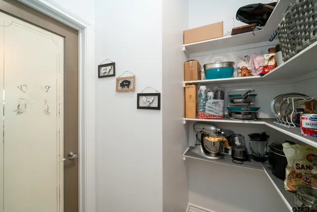 a view of storage and utility room with rack and bicycle