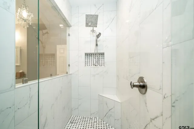 a bathroom with a bathtub and shower