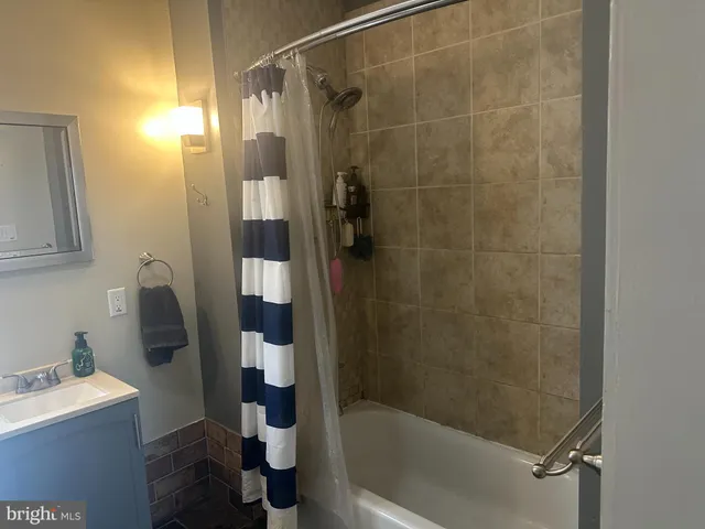 a bathroom with a shower and a toilet