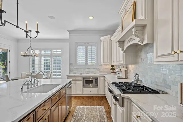 a view of wooden floor and windows in a room