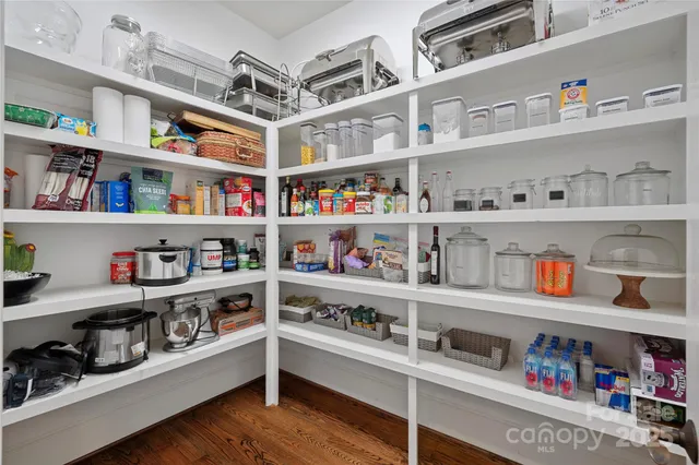 a view of a door with a sink and cabinets