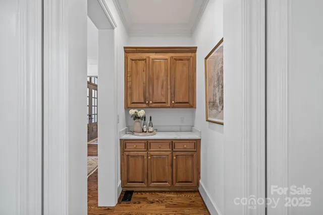 a bathroom with a sink a shower and a mirror