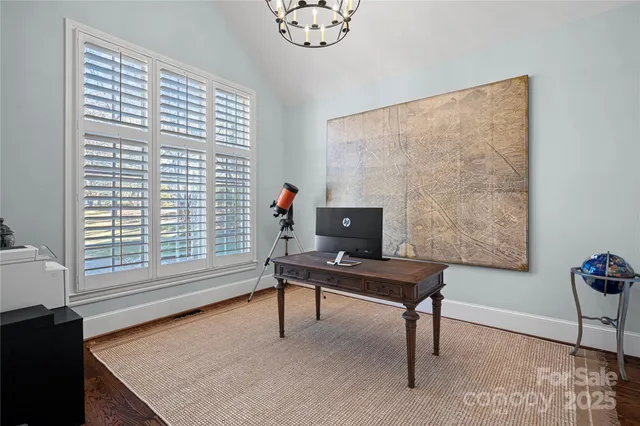 a bed room with a bed and a chair