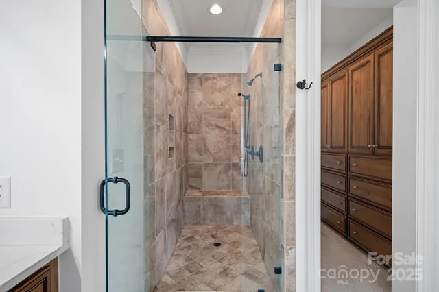 a spacious bedroom with a bed closet and a window