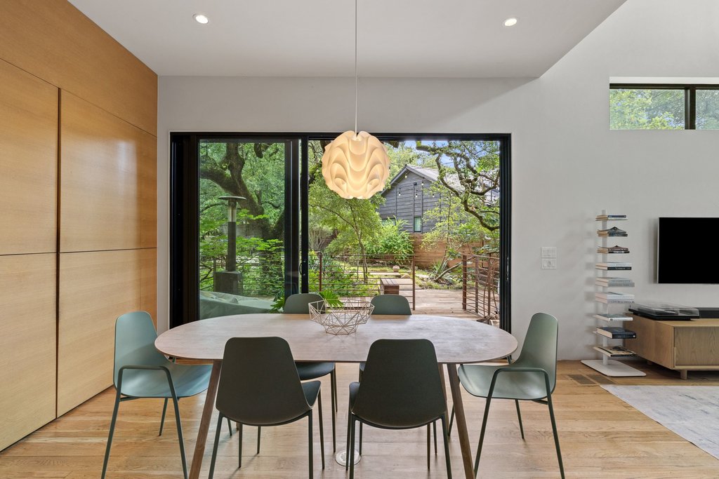 801 The High Road Austin, TX 78746 - Photo 5 of 40 a view of a dining room with furniture window and outside view