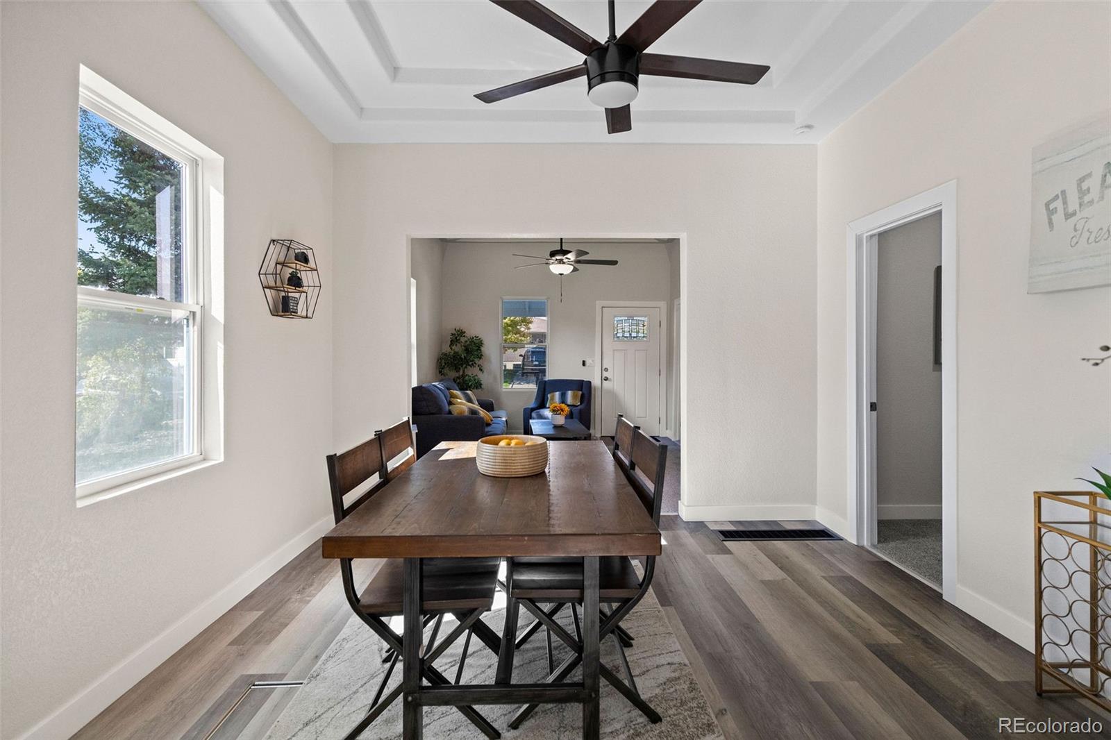 146 Stuart Street Denver, CO 80219 - Photo 11 of 31 a view of a dining room with furniture window and wooden floor