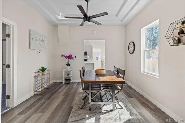 a view of a dining room with furniture window and wooden floor