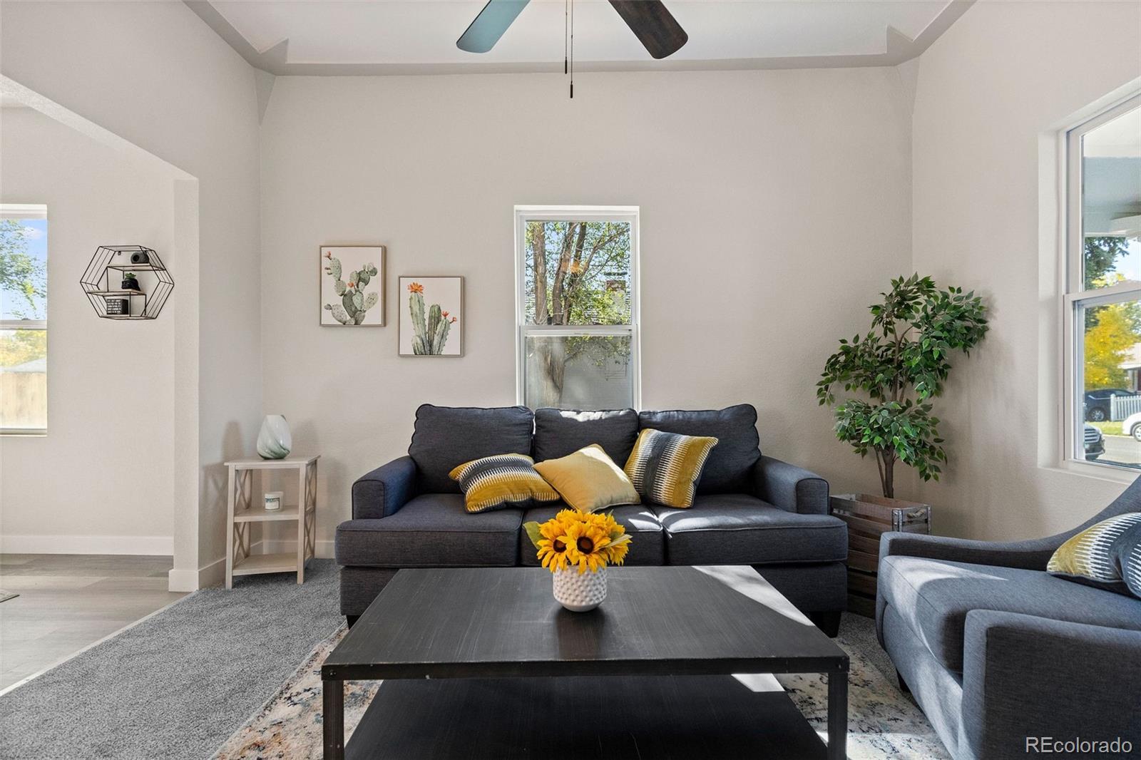 146 Stuart Street Denver, CO 80219 - Photo 16 of 31 a living room with furniture and window
