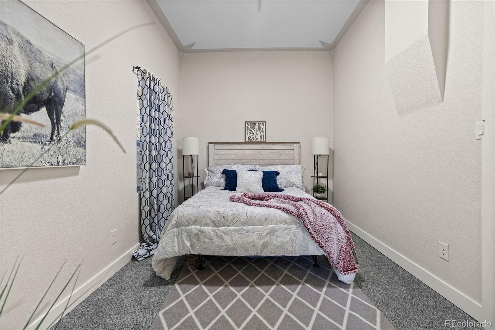 146 Stuart Street Denver, CO 80219 - Photo 18 of 29 a bedroom with a bed and a window