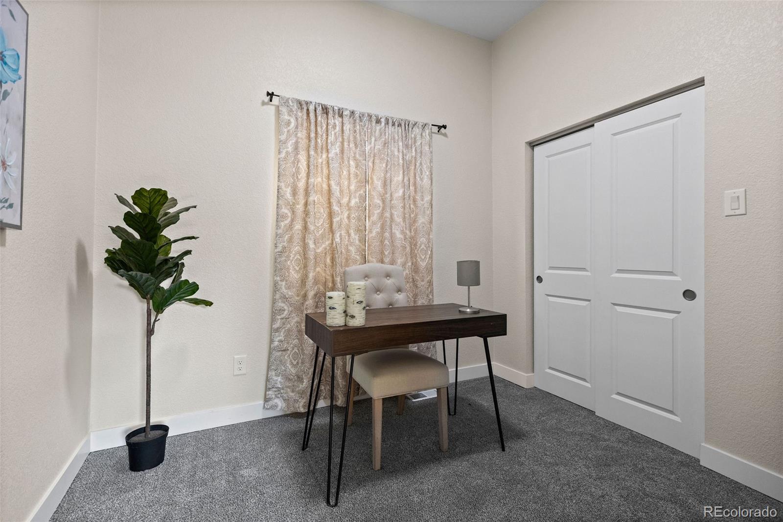 146 Stuart Street Denver, CO 80219 - Photo 19 of 29 a view of a workspace with furniture