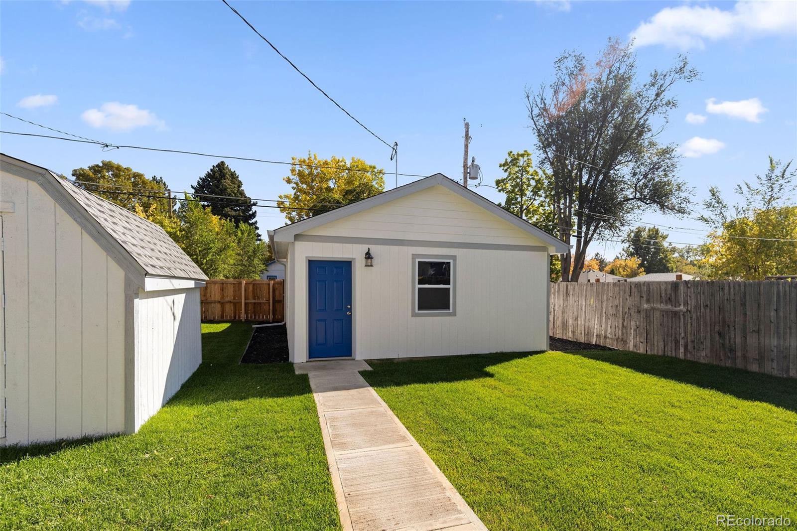 146 Stuart Street Denver, CO 80219 - Photo 22 of 29 a view of backyard with potted plants
