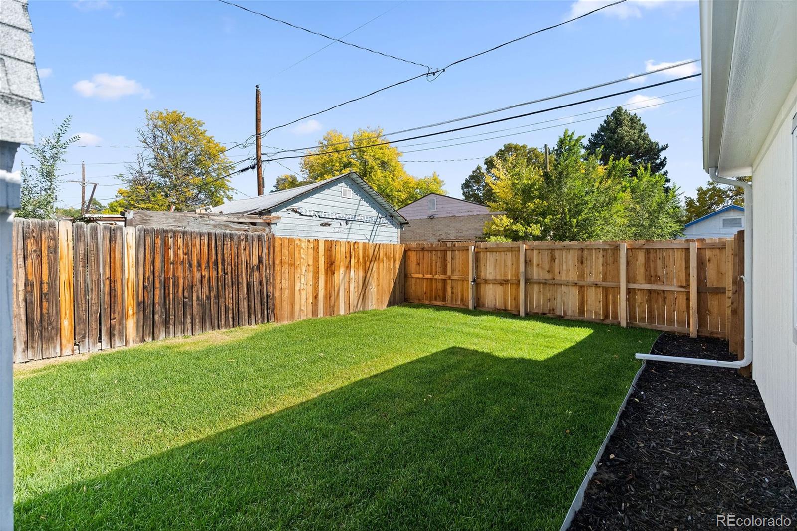 146 Stuart Street Denver, CO 80219 - Photo 27 of 31 a view of a house with a yard
