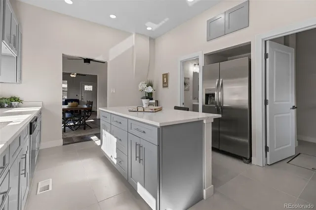 a bathroom with a double vanity sink mirror and shower