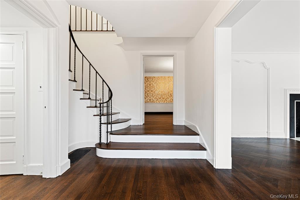 6 Fox Meadow Road Scarsdale, NY 10583 - Photo 2 of 20 Stairs with wood finished floors, visible vents, and baseboards
