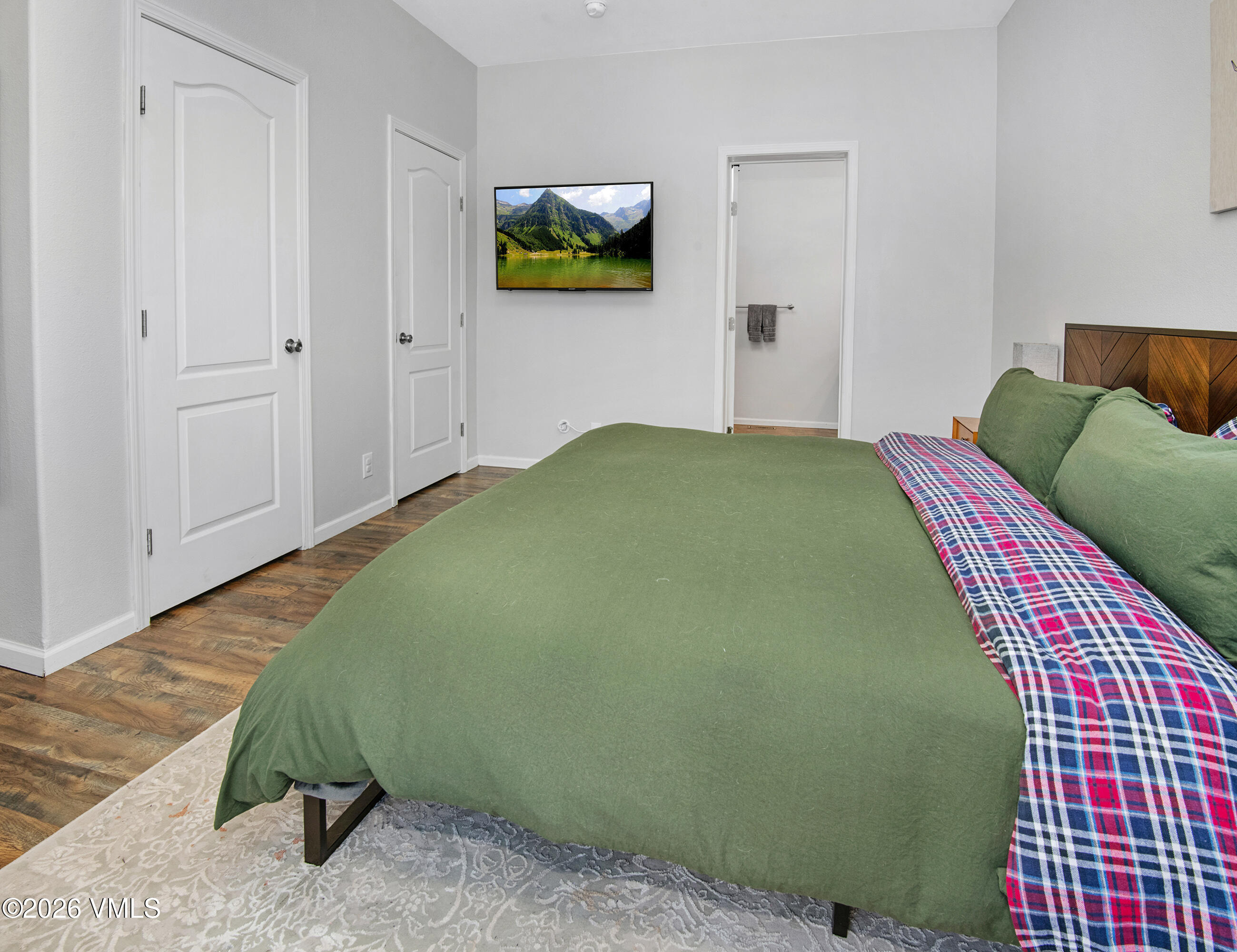 67 Maverick Court Gypsum, CO 81637 - Photo 15 of 40 a bedroom with a bed and painting on the wall