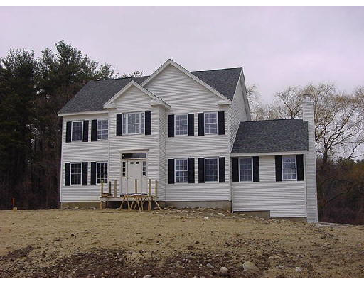 393-l1 Erickson Road Ashby, MA 01431 - Photo 1 of 1 a house that has a large tree in front of it
