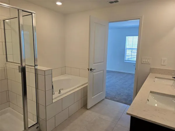 a bathroom with a bathtub and a sink