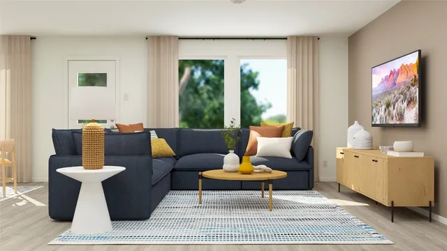a living room with furniture potted plant and a window