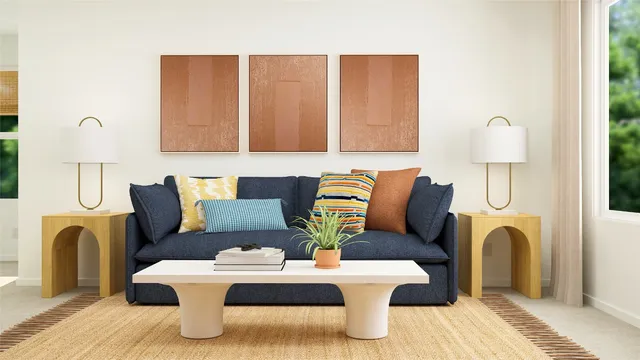 a living room with furniture and a potted plant