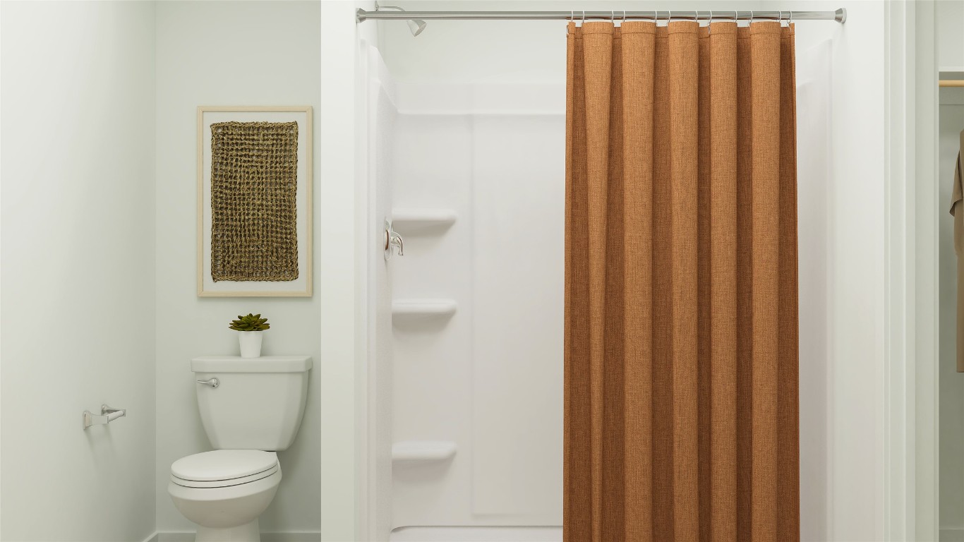 429 Silvercloud Drive Lockhart, TX 78644 - Photo 34 of 37 a bathroom with a toilet and a shower curtain