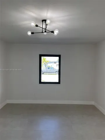 a white toilet sitting next to a bath tub