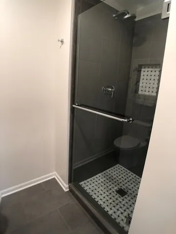 an empty room with wooden floor