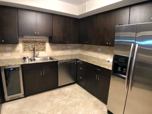 a kitchen with a sink and cabinets