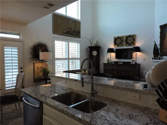 a kitchen with a sink and a microwave