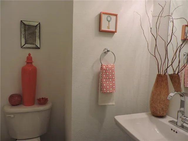 a bathroom with a toilet and a sink