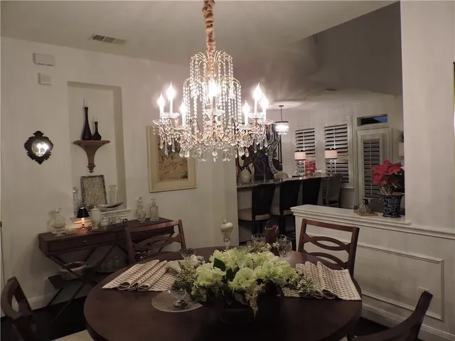 a room with furniture and chandelier