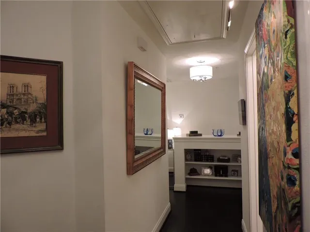 a view of a bathroom with a sink and a mirror