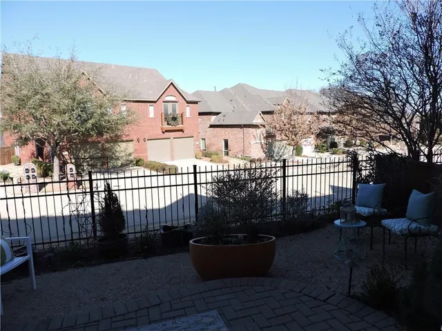 a view of a house with backyard and porch