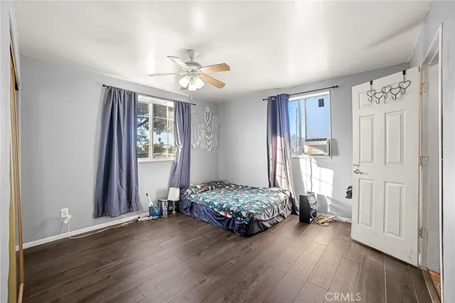 a bedroom with furniture and a window