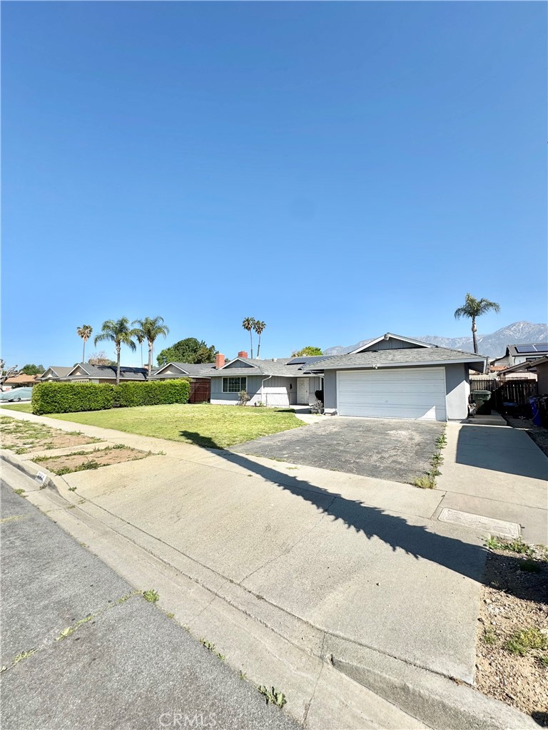 9364 Langston Street Rancho Cucamonga, CA 91730 - Photo 16 of 17 a view of a house with a yard and sitting area