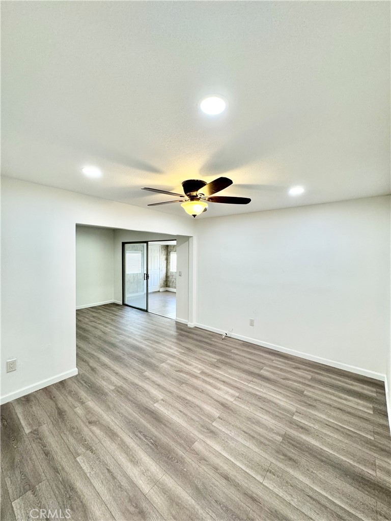 9364 Langston Street Rancho Cucamonga, CA 91730 - Photo 5 of 17 a view of empty room with wooden floor