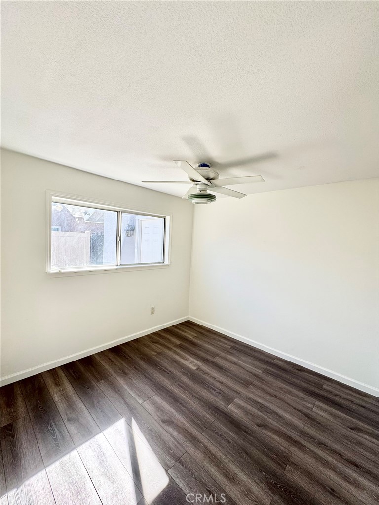 9364 Langston Street Rancho Cucamonga, CA 91730 - Photo 8 of 17 an empty room with wooden floor closet and windows