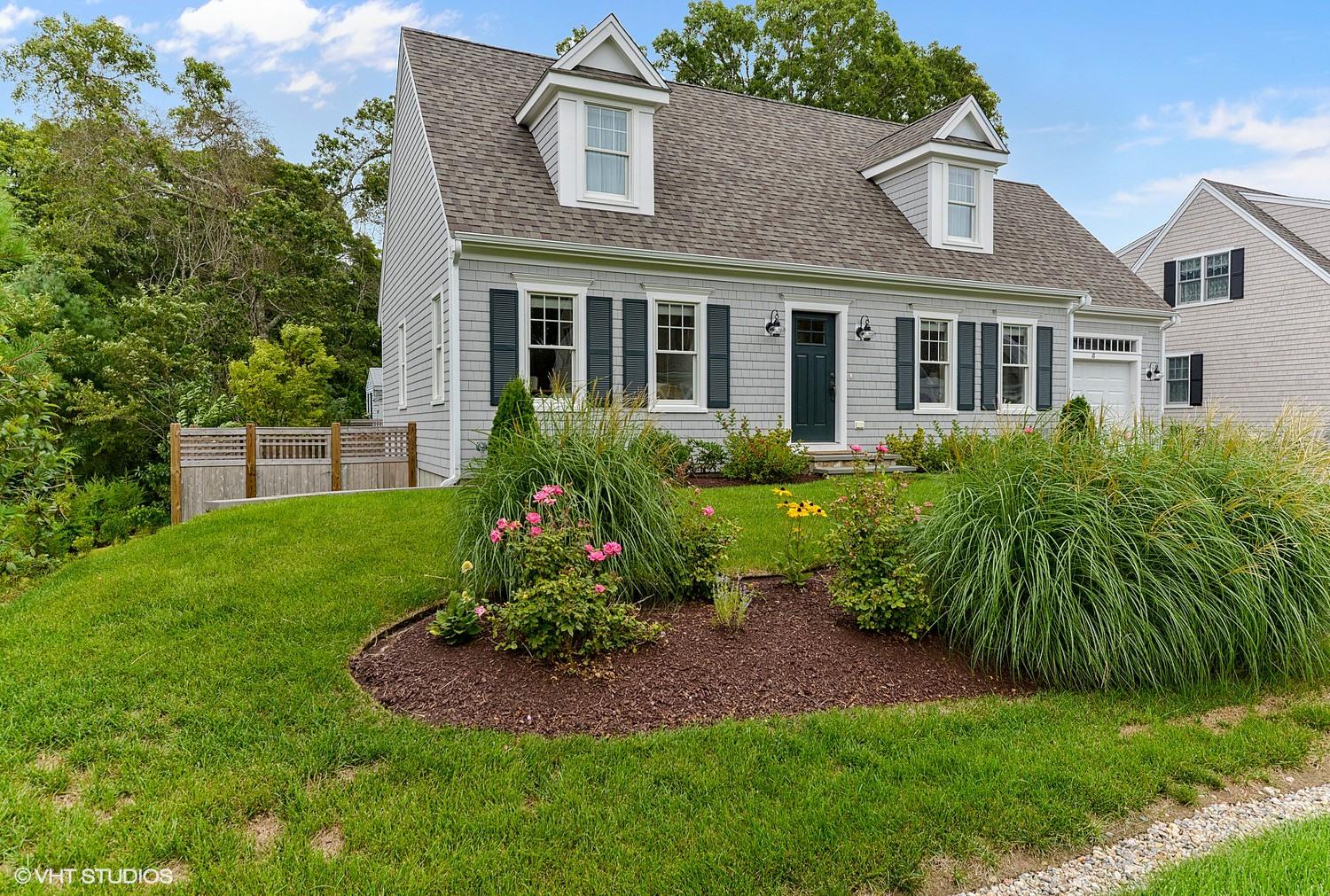 18 Darby Way Osterville, MA 02655 - Photo 1 of 15 a view of a house with a garden and plants