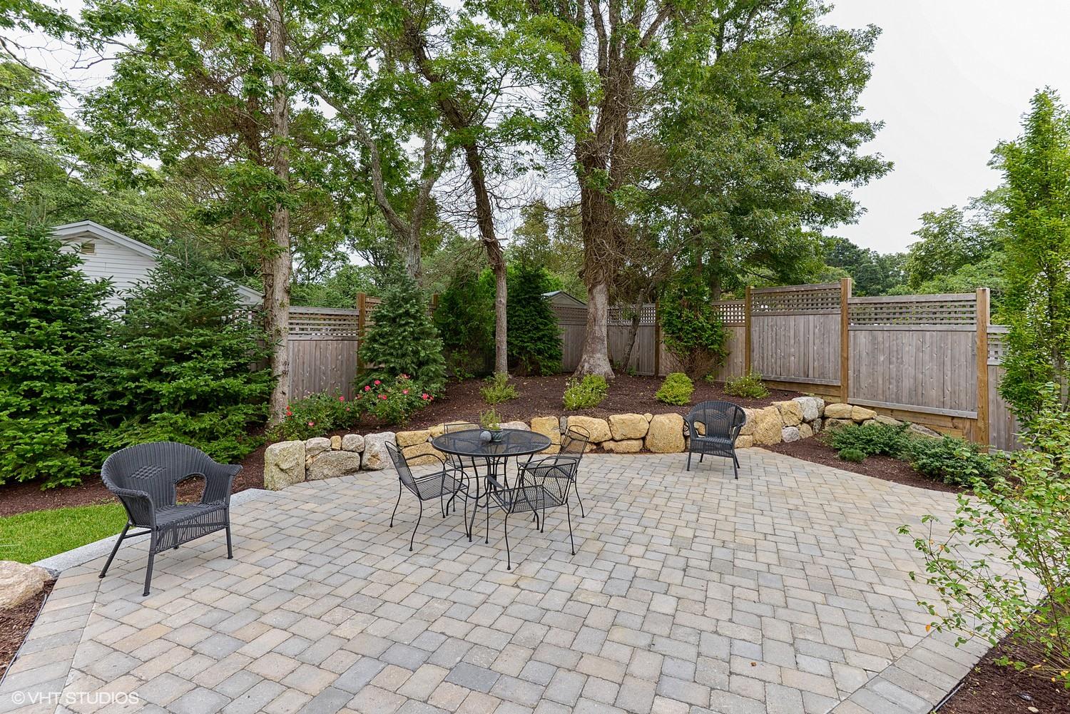 18 Darby Way Osterville, MA 02655 - Photo 13 of 15 a view of backyard with outdoor seating and trees