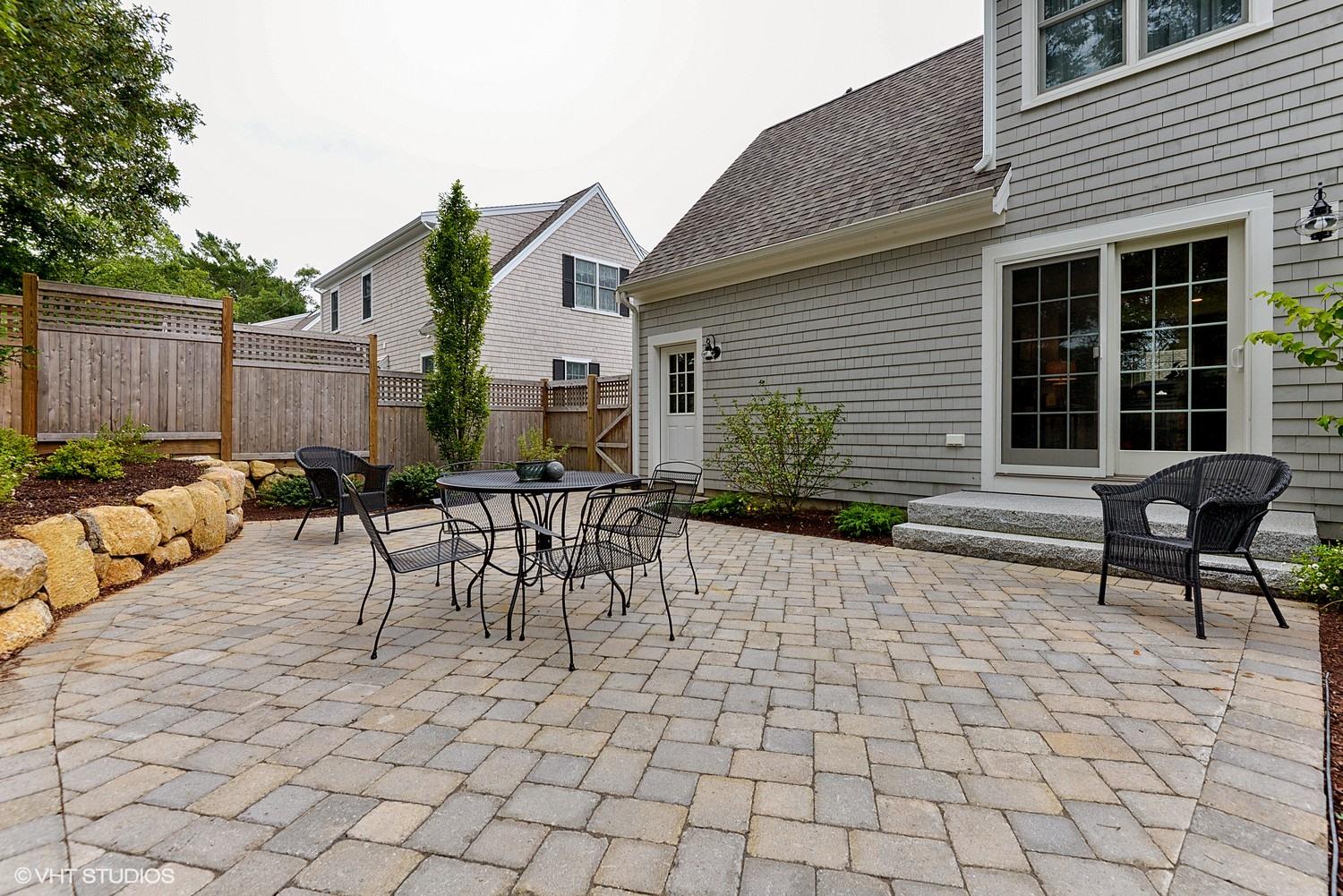 18 Darby Way Osterville, MA 02655 - Photo 14 of 15 a view of a patio with table and chairs