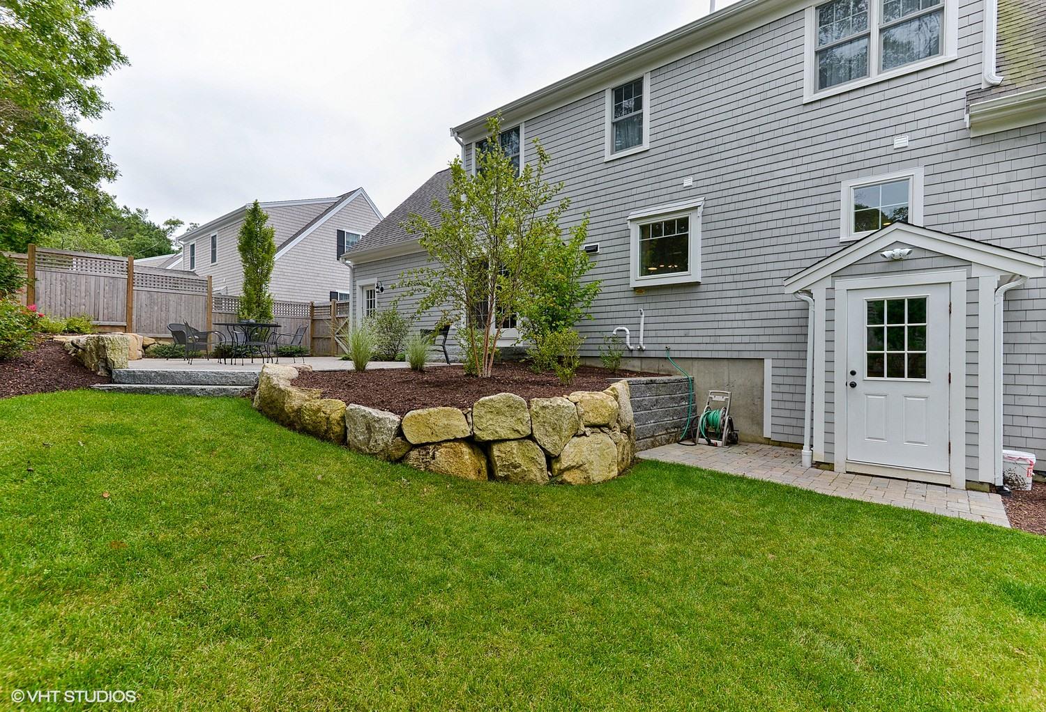 18 Darby Way Osterville, MA 02655 - Photo 15 of 15 a view of a house with a yard and sitting area