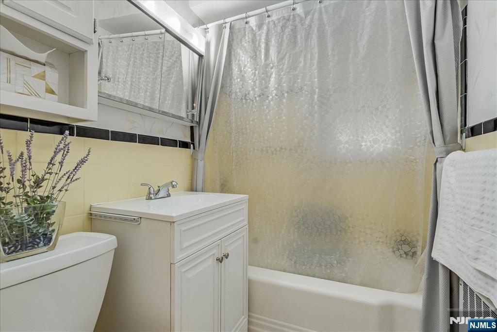 29 Lynwood Road Verona, NJ 07044 - Photo 14 of 39 a bathroom with a sink a toilet and shower