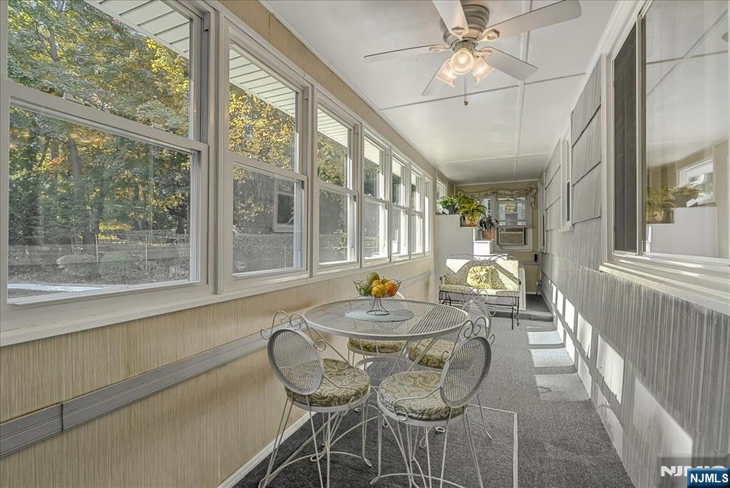 29 Lynwood Road Verona, NJ 07044 - Photo 17 of 39 a dining room with furniture a chandelier and wooden floor