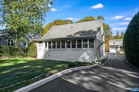 a house with trees in the background