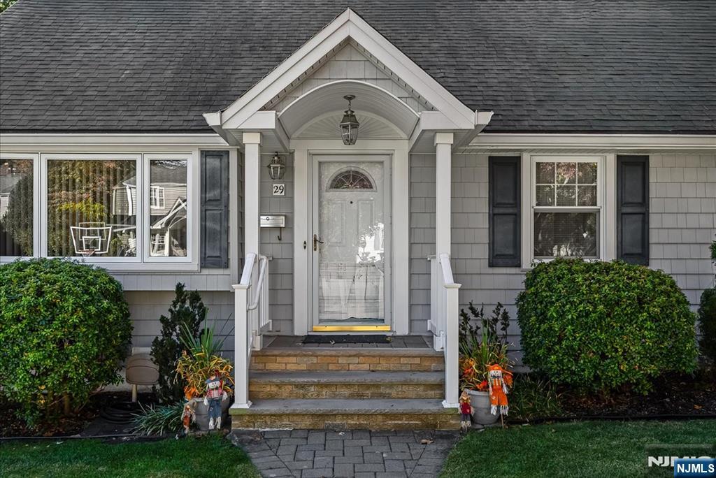 29 Lynwood Road Verona, NJ 07044 - Photo 3 of 39 a front view of a house with a garden
